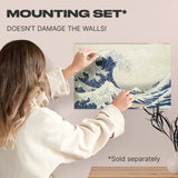The Great Wave off Kanagawa wooden puzzle — hand holding wooden puzzle piece detail