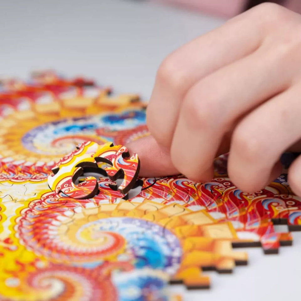 Fractal Immersion wooden brain teaser puzzle — in use with hands assembling