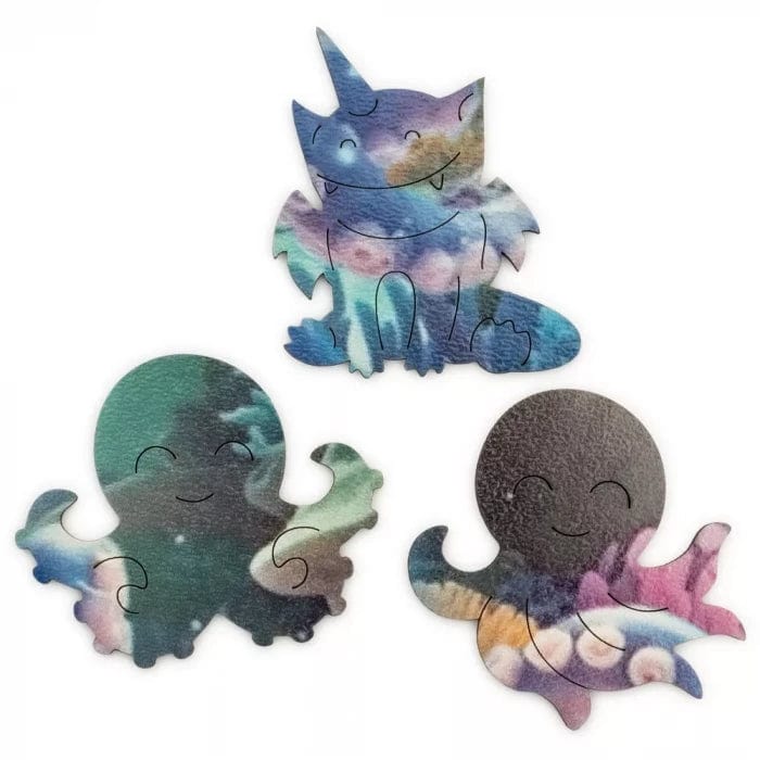 Octopus Bubblezz Bubblezz wooden puzzle — hand holding wooden puzzle piece detail