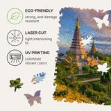 Chiang Mai wooden travel puzzle — hand holding wooden puzzle piece detail