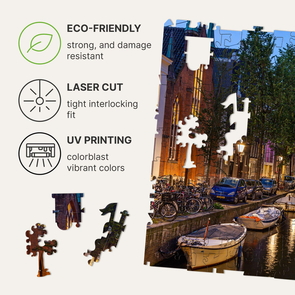 Amsterdam City wooden travel puzzle — hand holding wooden puzzle piece detail