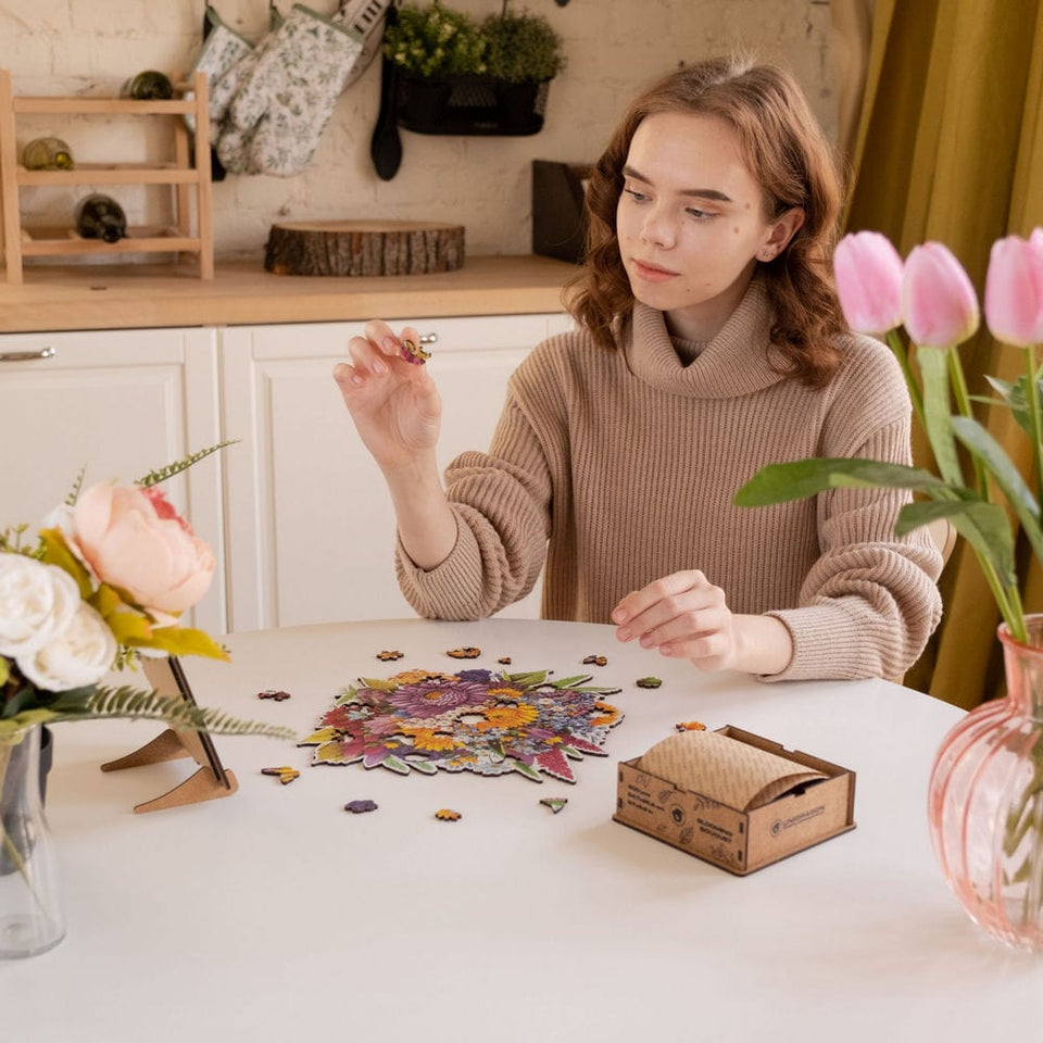 Blooming Bouquet wooden puzzle — in use with hands assembling
