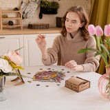 Blooming Bouquet wooden puzzle — in use with hands assembling