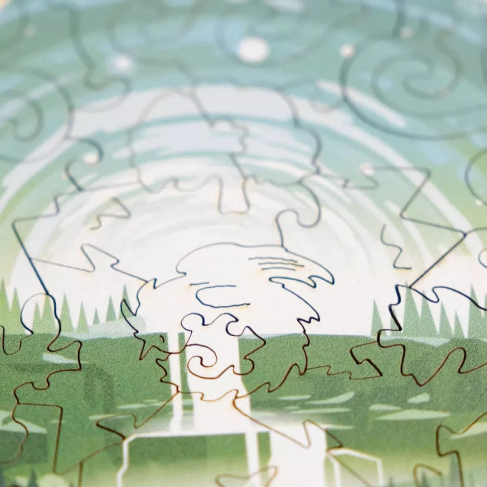 Endless Green wooden brain teaser puzzle — in use with hands assembling