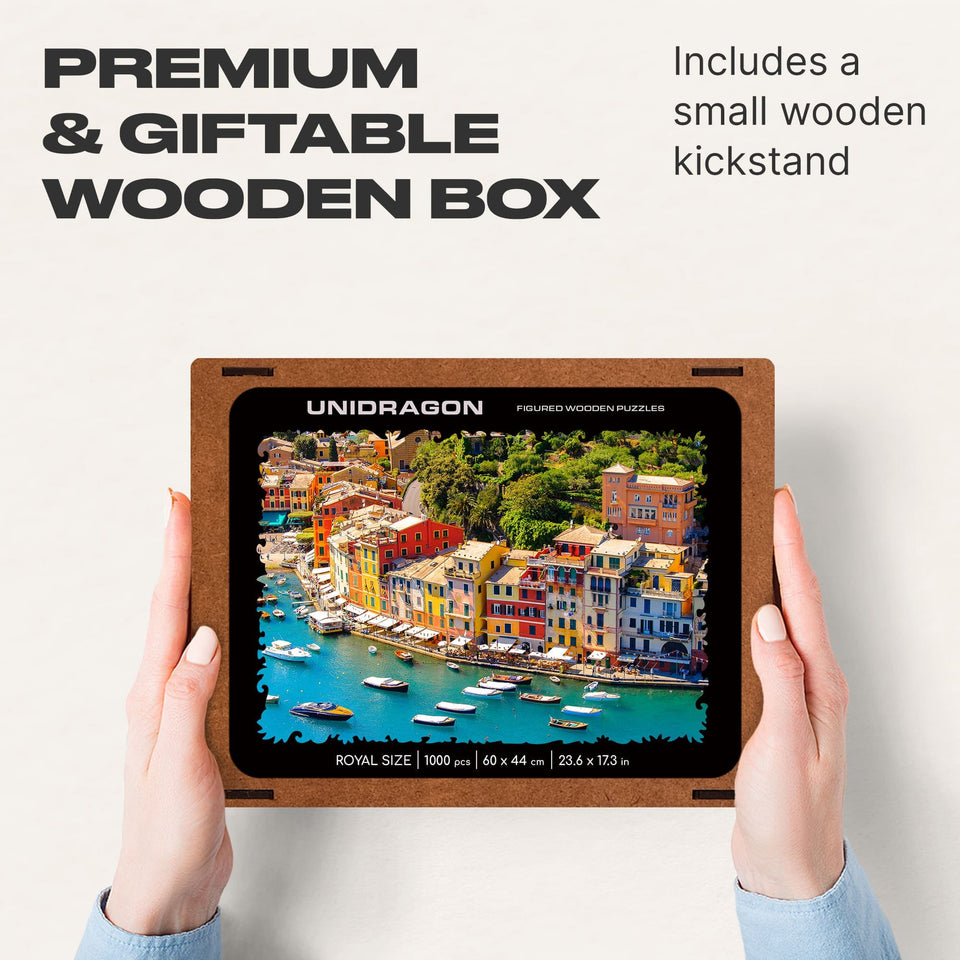 WOOSAIC Italian Riviera Limited Edition wooden travel puzzle — hand holding wooden puzzle piece detail
