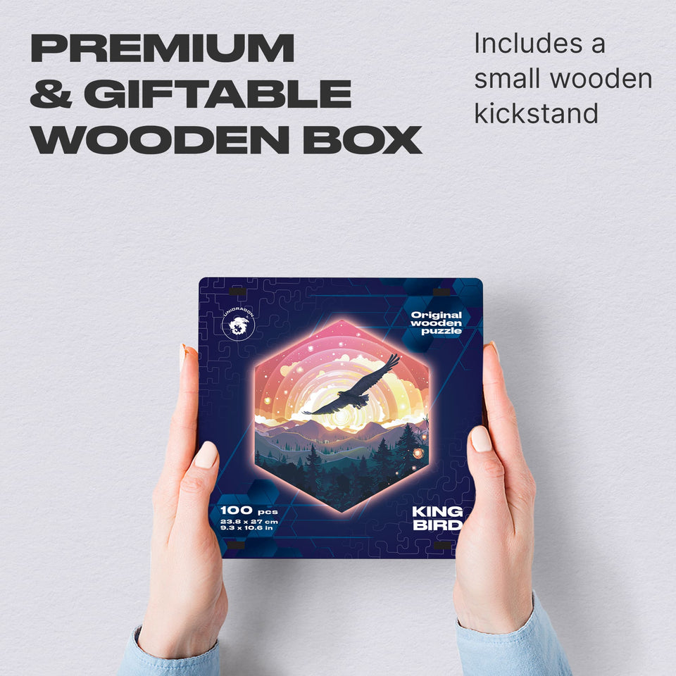 King Bird wooden brain teaser puzzle — hand holding wooden puzzle piece detail