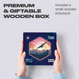 King Bird wooden brain teaser puzzle — hand holding wooden puzzle piece detail