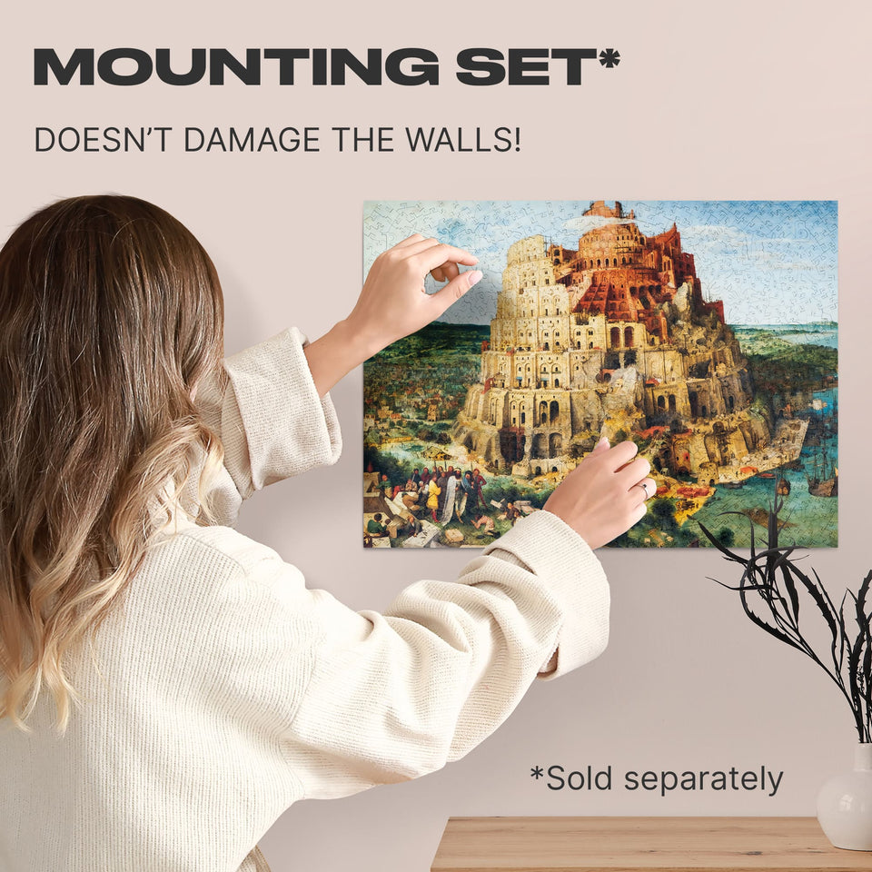Tower of Babel wooden art puzzle — hand holding wooden puzzle piece detail