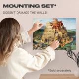 Tower of Babel wooden art puzzle — hand holding wooden puzzle piece detail