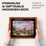 WOOSAIC Sakura Limited Edition wooden travel puzzle — hand holding wooden puzzle piece detail