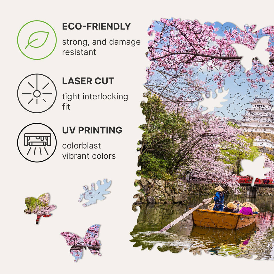 Sakura wooden travel puzzle — hand holding wooden puzzle piece detail