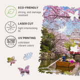 Sakura wooden travel puzzle — hand holding wooden puzzle piece detail