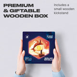 Solar Whale wooden brain teaser puzzle — hand holding wooden puzzle piece detail