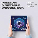 Space Station wooden brain teaser puzzle — hand holding wooden puzzle piece detail