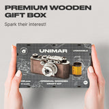 Camera Unimar wooden puzzle — hand holding wooden puzzle piece detail