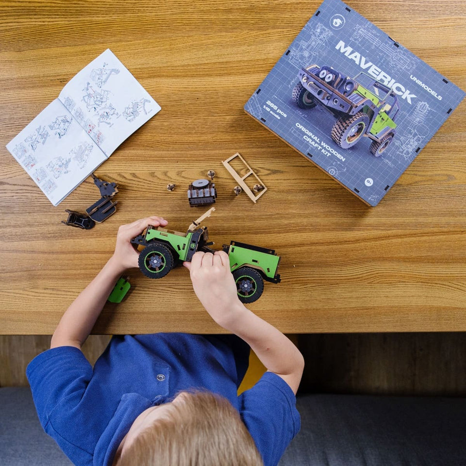 Maverick Green Puzzle wooden puzzle — in use with hands assembling
