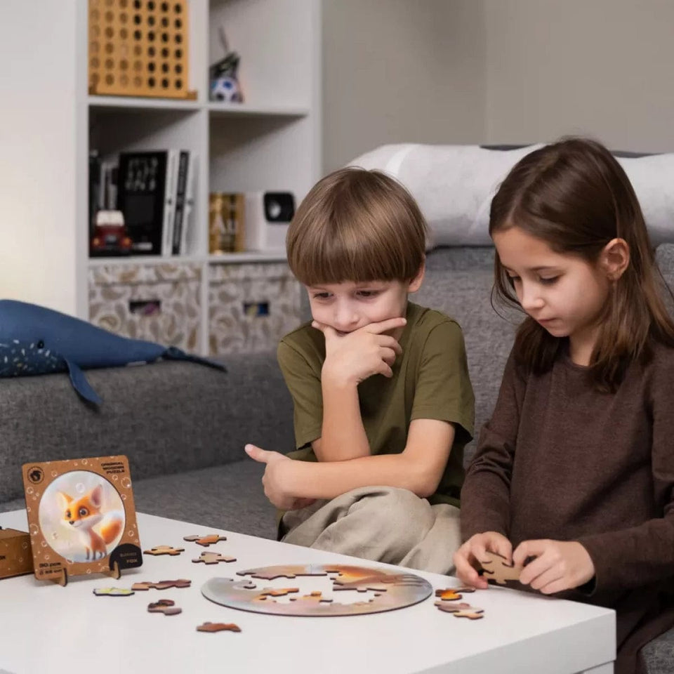 Fox Bubblezz Bubblezz wooden puzzle — in use with hands assembling