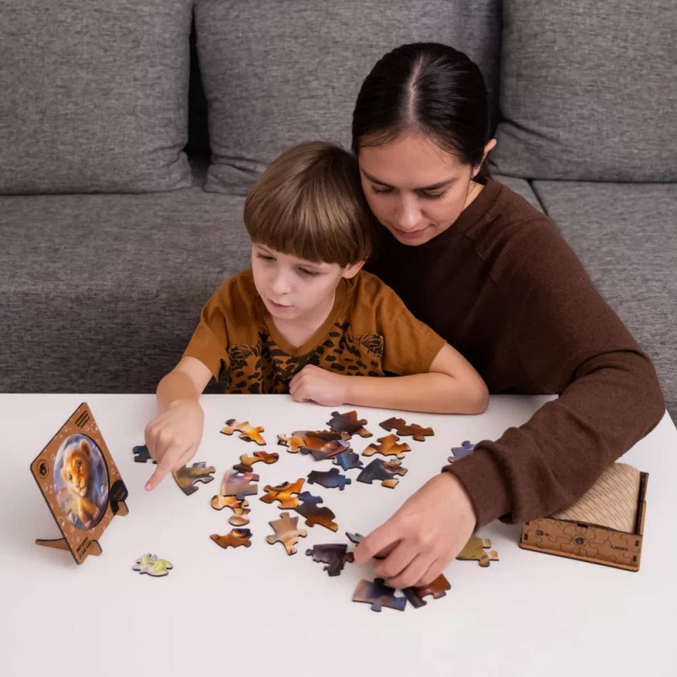 Lion Bubblezz Bubblezz wooden puzzle — in use with hands assembling
