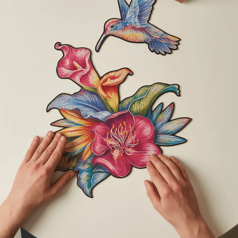Elusive Colibri wooden animal puzzle — in use with hands assembling