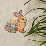 Precious Rabbit wooden puzzle — in use with hands assembling