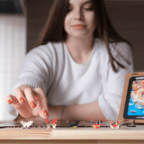 WOOSAIC Italian Riviera Limited Edition wooden travel puzzle — in use with hands assembling