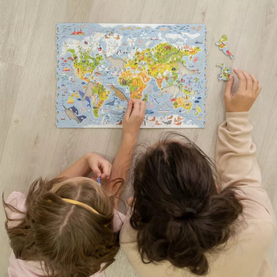 World Map wooden map puzzle — in use with hands assembling