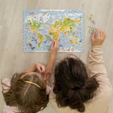 World Map wooden map puzzle — in use with hands assembling