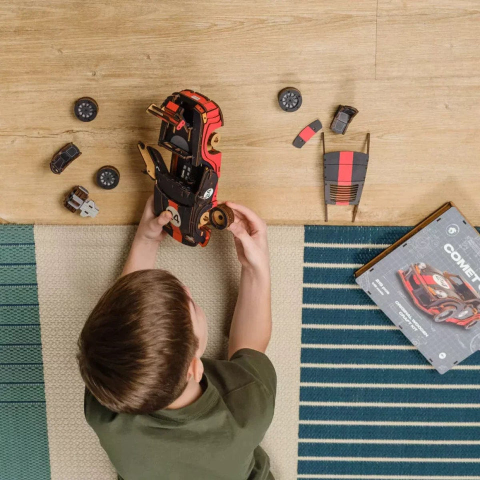 Comet GTS Black-Red Puzzle wooden puzzle — in use with hands assembling