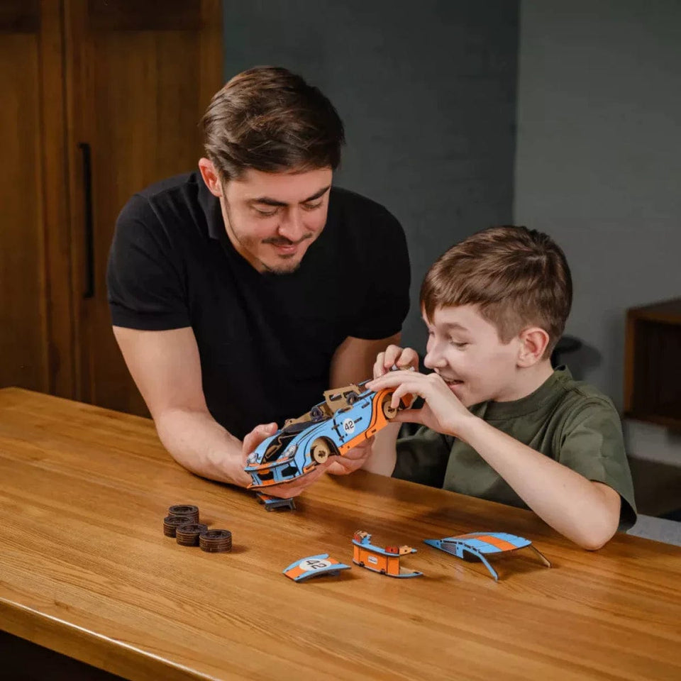 Comet GTS Blue-Orange Puzzle wooden puzzle — in use with hands assembling