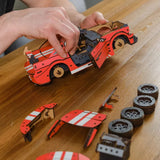 Stallion GT Red Puzzle wooden car puzzle — in use with hands assembling