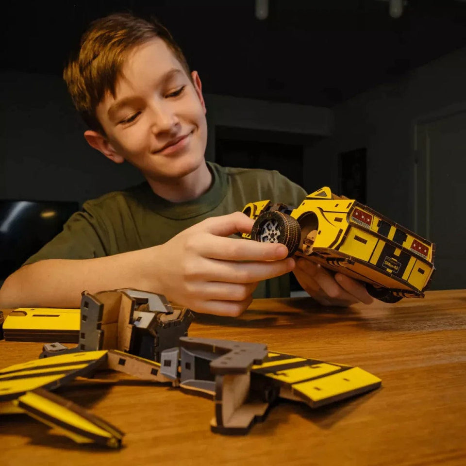 Stallion GT Yellow Puzzle wooden car puzzle — in use with hands assembling